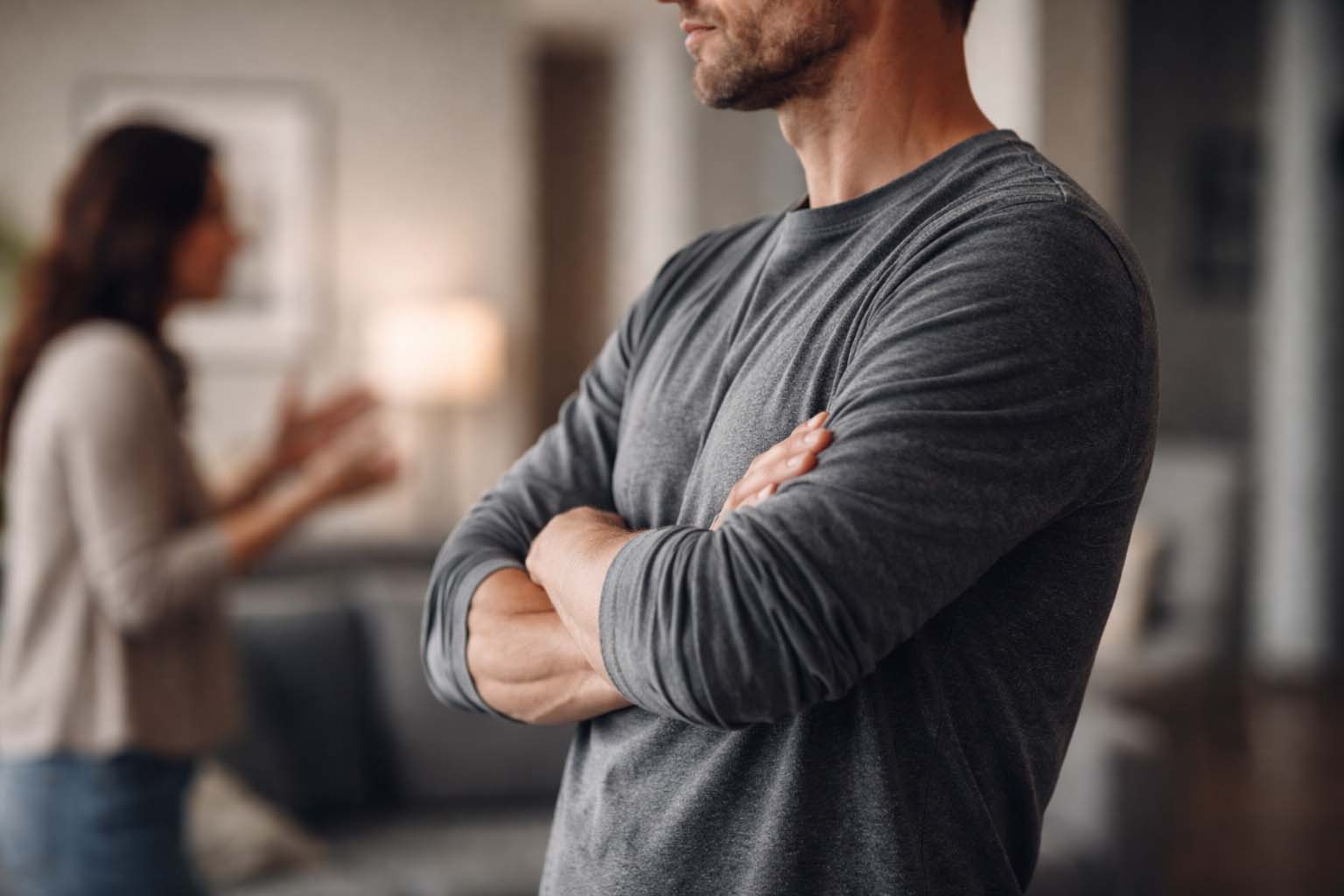 Person standing firm with crossed arms in an argument